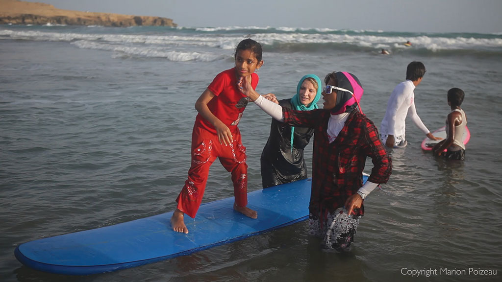 Teaching children to surf in Iran